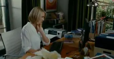 Cameron Diaz sits in a white Eames chair in The Holiday