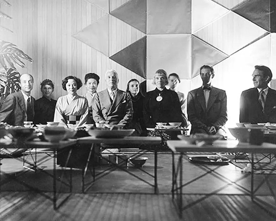 Photograph by Charles Eames featuring Isamu Noguchi, Shirley Yamaguchi, Charlie Chaplin, Charles Eames and others at a Japanese tea ceremony held at the Eames house.
