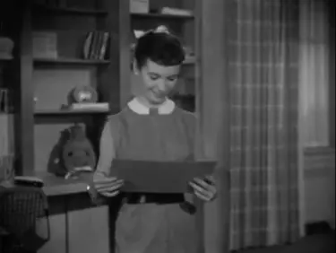 The Moon is Blue. Eames wire chair seen at the desk to the left