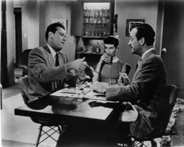 The Moon is Blue. The dining scene with three Eames wire chairs