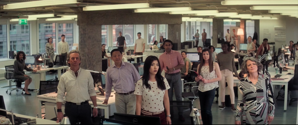 The office workers look on disbelief as Tom Cruise realises he has no choice but to jump through the window