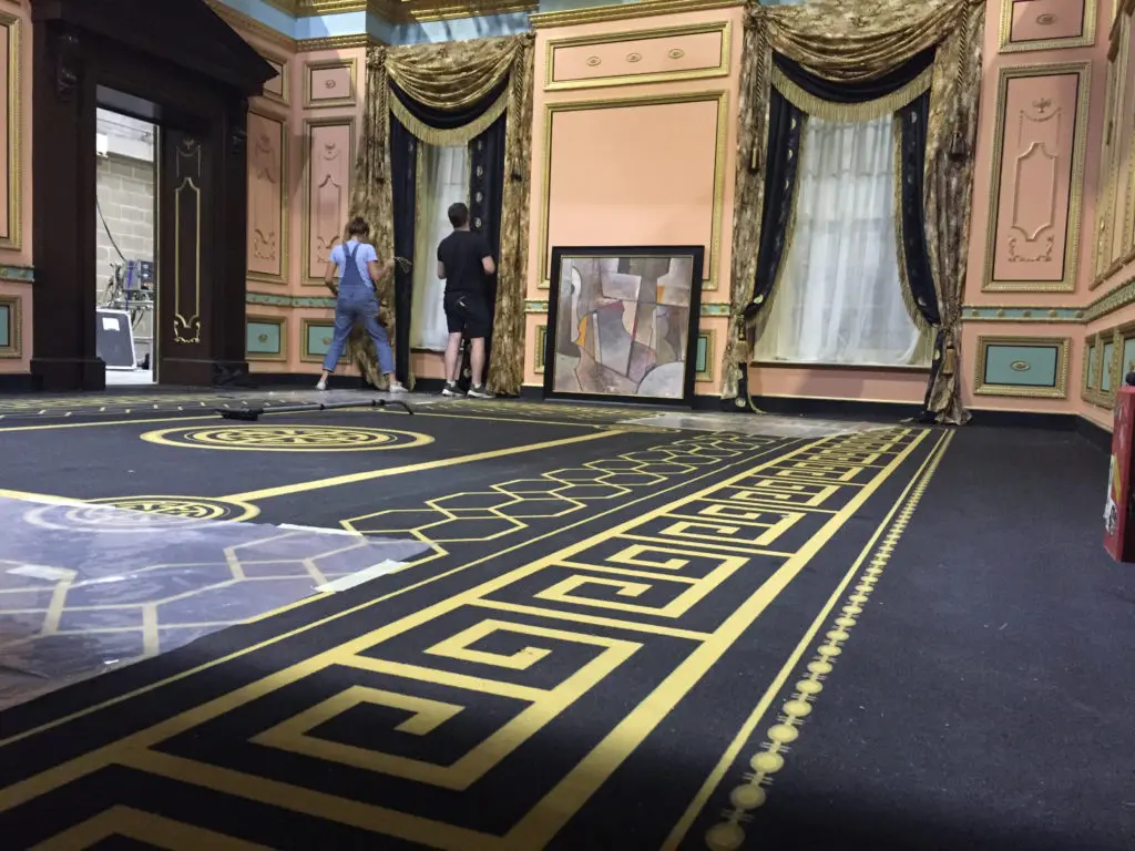 The set of John Reid's office in Rocketman in the process of being dressed