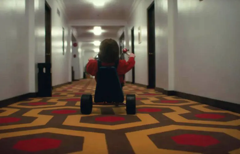 Danny on his tricycle in the Overlook Hotel - an exact recreation of Kubrick's The Shining