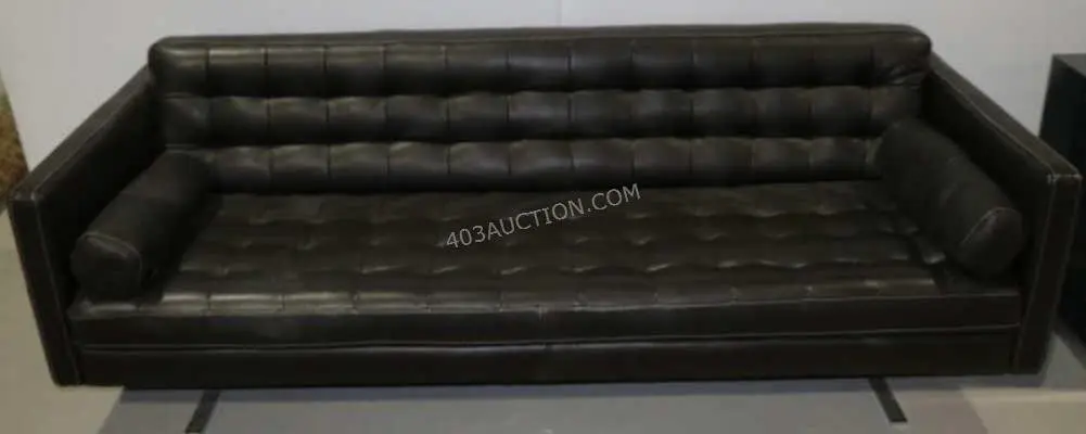 Suits: Harvey Specter's black sofa couch