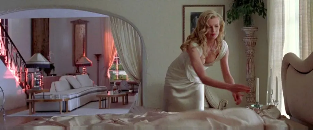 Lynn Bracker's house in LA Confidential was filmed in a Spanish style house designed by silent film actor/architect Jack Donovan in 1923 known as the John C. Leavitt house. Oppewall and set decorator Jay Hart furnished it with white furniture which they sourced from a consignment house in Palm Springs.