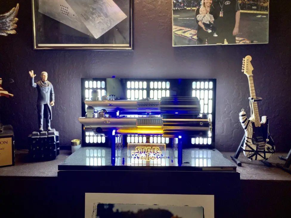 Greg's lightsabres sit proudly in his home office