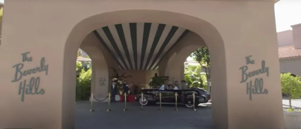The entrance to The Beverly Hills Hotel with the famous green and white stripes