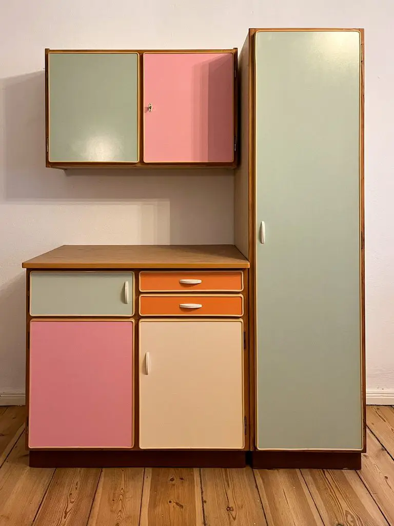 Multi-coloured original retro vintage 1950s kitchen cabinets as seen in The Queen’s Gambit, by VEB Kuechenmoebel Eschebach