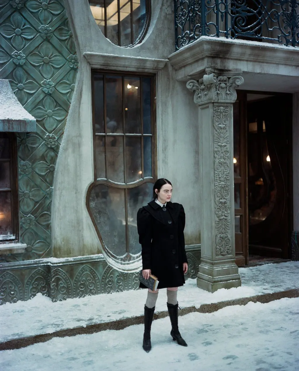 Bella outside the Brothel in Paris film sets of Poor Things