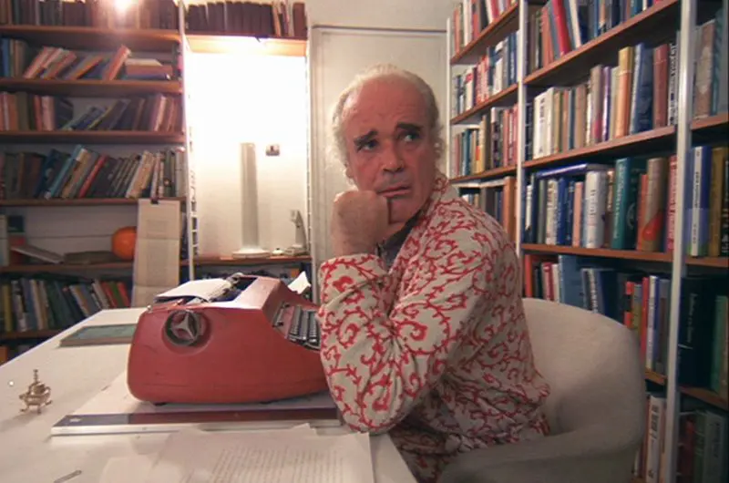 Mr Alexanda sitting in the Saarinen chair in A Clockwork Orange