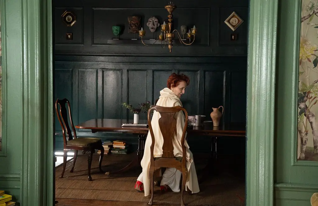 Fiona Shaw as Kit in the dining are of the apartment in Park Avenue