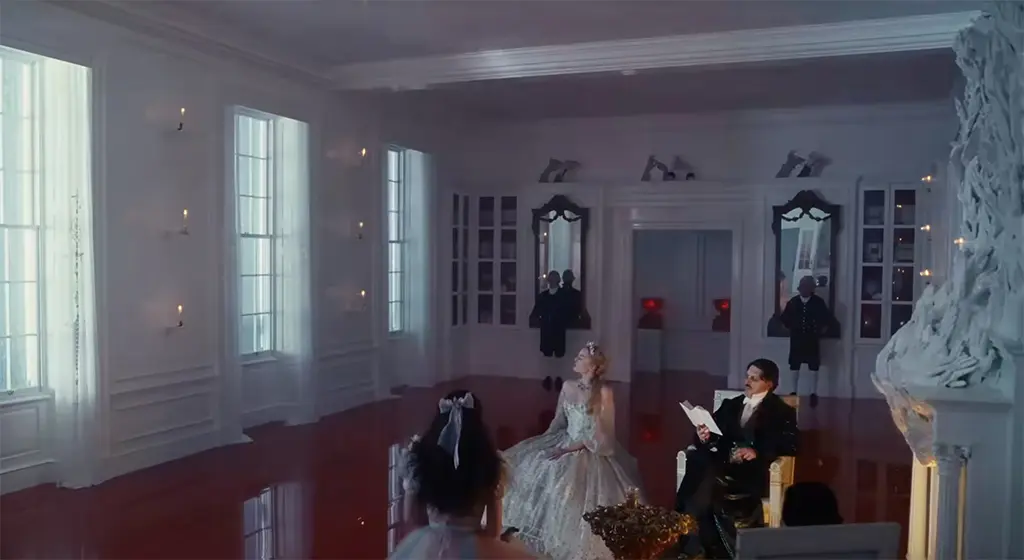 Wuthering Heights: Thrushcross Grange library with shiny red-floor and fireplace surround make from hands.