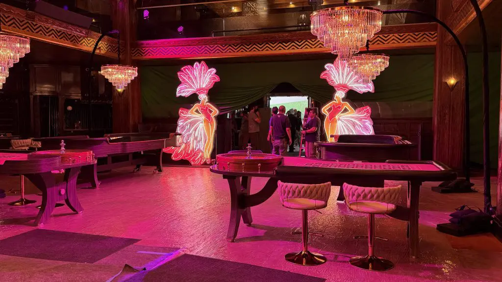 Hacks Season 5: The Diva film set with showgirls neon