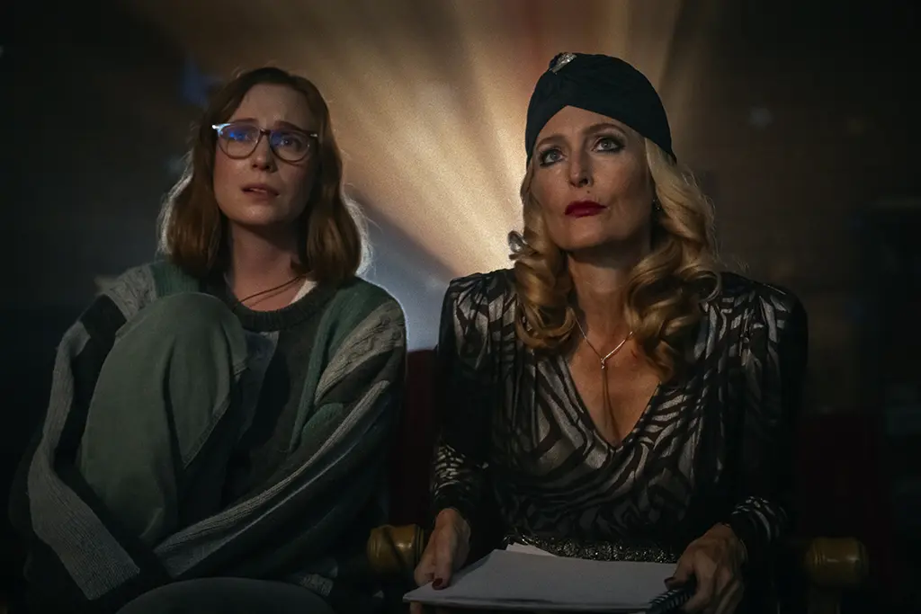 Billy and Kris in the cinema room in Teenage Sex and Death at Camp Miasma