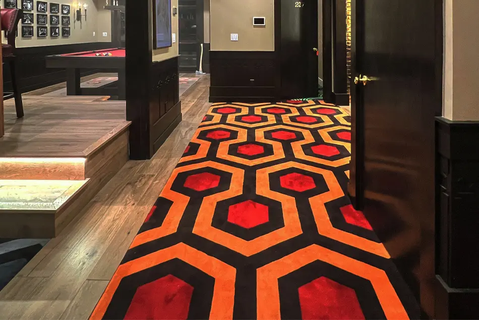 Hicks Hexagon hand-tufted 1 ply wool makes an entrance to our Park City client's basement hideout