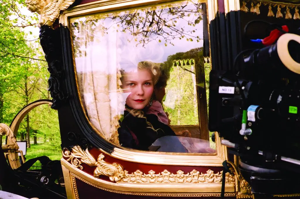 Kirsten Dunst in a coach on the set of Marie Antoinette