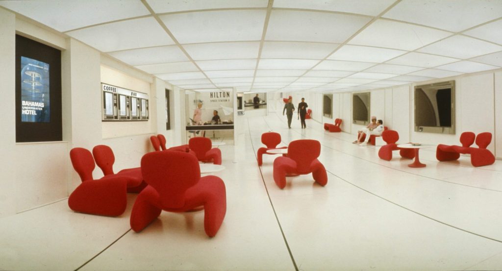 A scene on Space Station V, featuring red Djinn chairs, in 2001: A SPACE ODYSSEY (1968, Dir. Stanley Kubrick). Credit: Courtesy of Warner Bros.