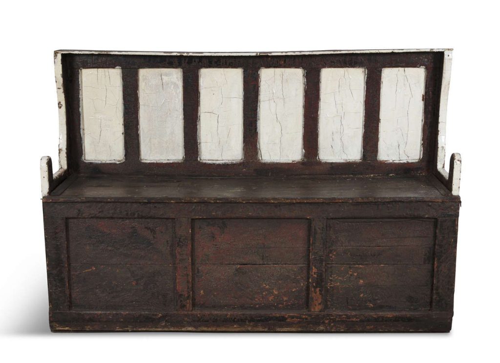 19th-century painted pine settle bed as seen in - Lot 135. Courtesty of Adam's Auctioneers.